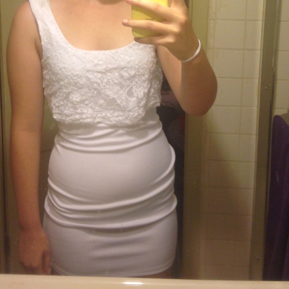 White body dress with lace at the straps and bust.