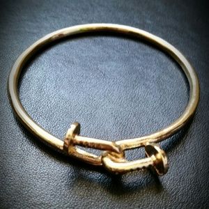 Gold colored nail bracelet
