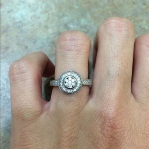 18K White Gold with ~ 1/15 TW diamonds.