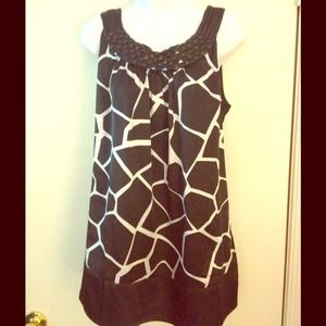 Satiny top with beaded neckline