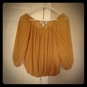 Mustard color top.