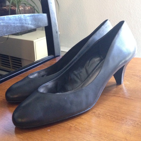 Size 11 small heel black pumps. Never worn.