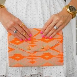 Bold Coral Aztec Clutch!
