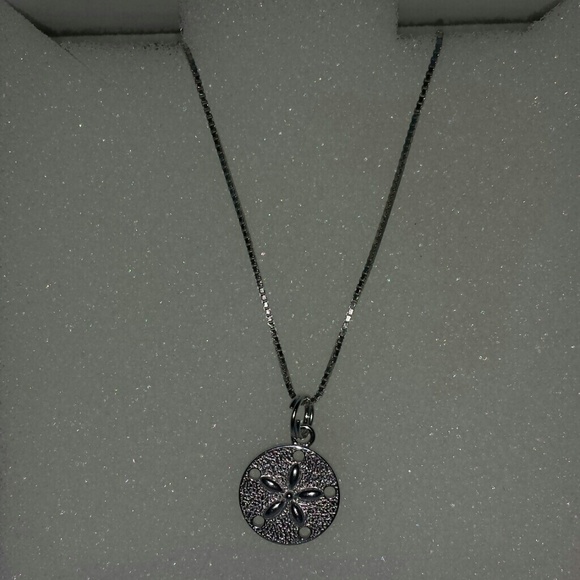 Beautiful sand dollar necklace.