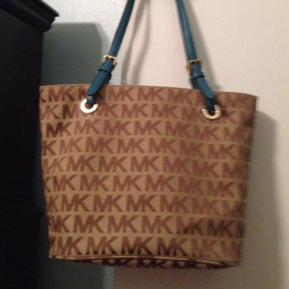 SOLD - MK logo canvas with teal leather trim.