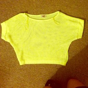 A neon yellow see threw crop top