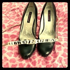 Black  heels with zebra print skinny belt.