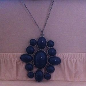 Long necklace with blue stoned pendant
