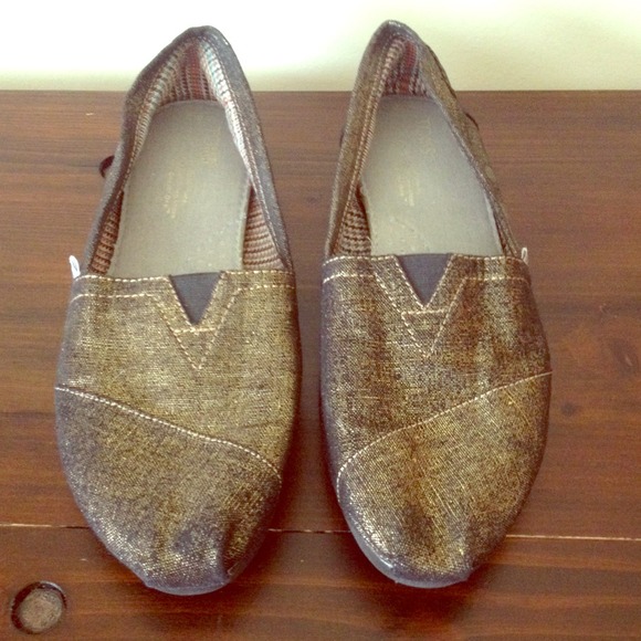 TOMS metallic slip ons with plaid lining