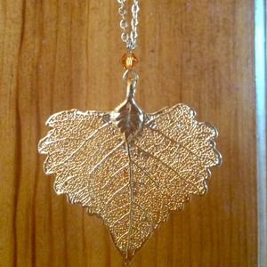 Real leaf necklace dipped in gold.