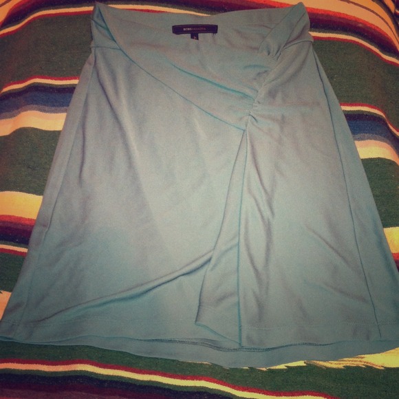 Teal knee length skirt with pleat detail