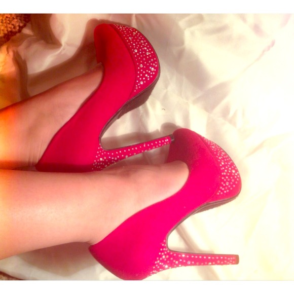 Red rhinestoned pumps