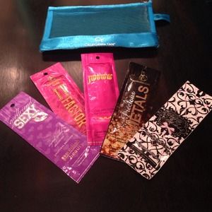Assortment of tanning lotion packets with bag