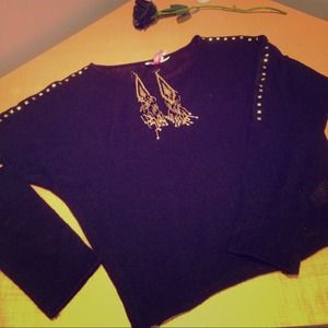 Black studded sweater with black and gold earring