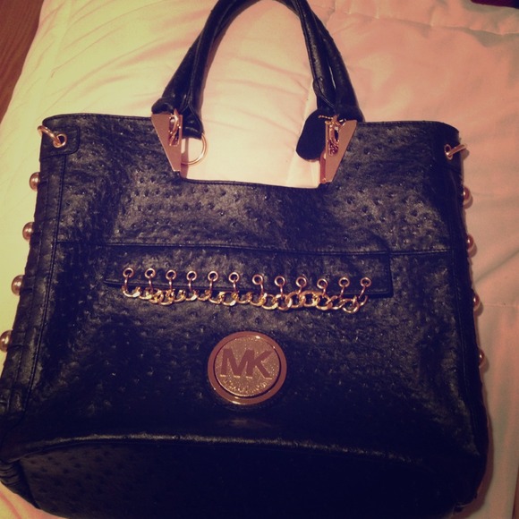 Large black MK tote with gold embellishments
