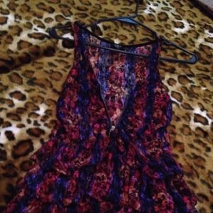 A floral blouse that zips. Up in the front