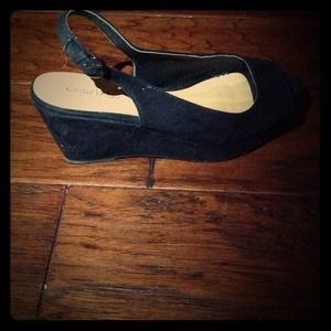 Black short heel shoes by Cabrizi