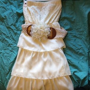White layered dress with flower and crochet belt