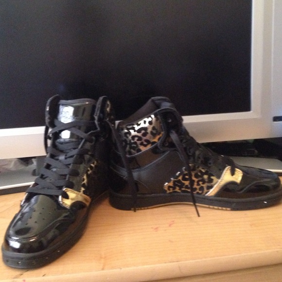 Black gold and gold cheetah high top shoes.