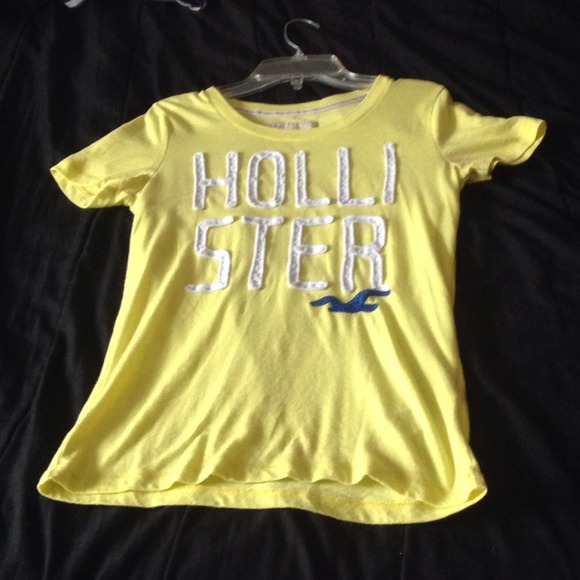 A yellow,white, and blue Hollister shirt