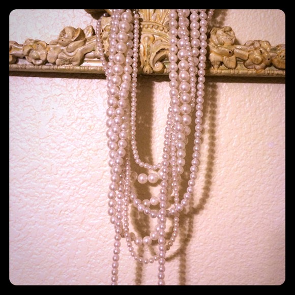 Long multiple strand pearl necklace