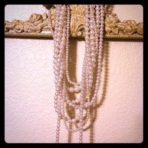 Long multiple strand pearl necklace