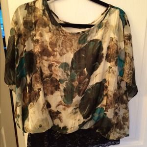 Fun and flirty lace bottom dressy top.