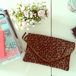 J Crew leopard clutch. In perfect condition. New