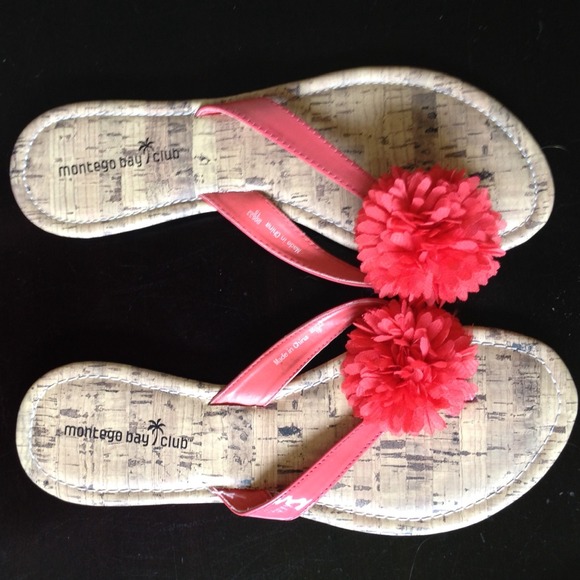 Peach sandals with flower embellishment