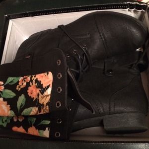 Black combat boot with floral cuff fold over