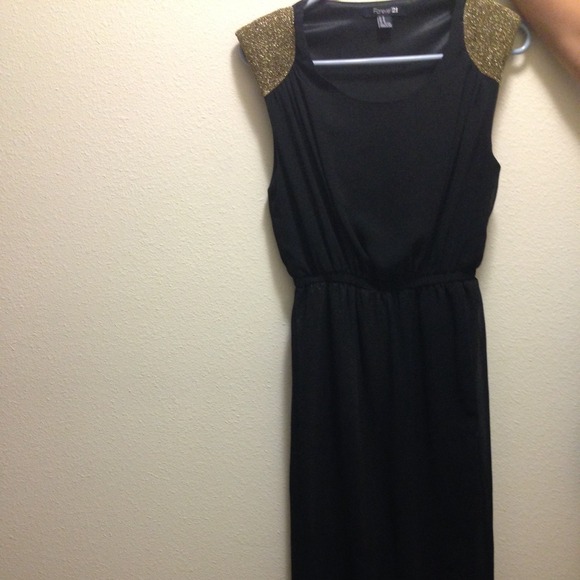 Black chiffon dress with gold sleeve and underlay