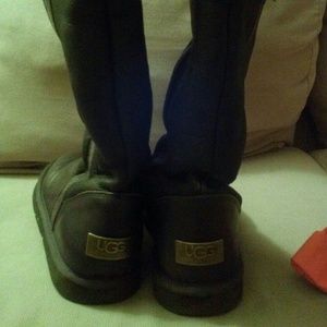 UGGs leather boots in dark brown.