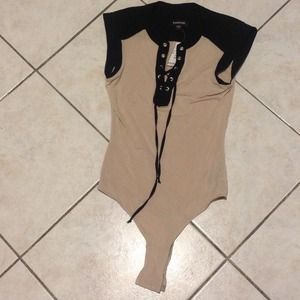 Bebe tan and black lace up body suit