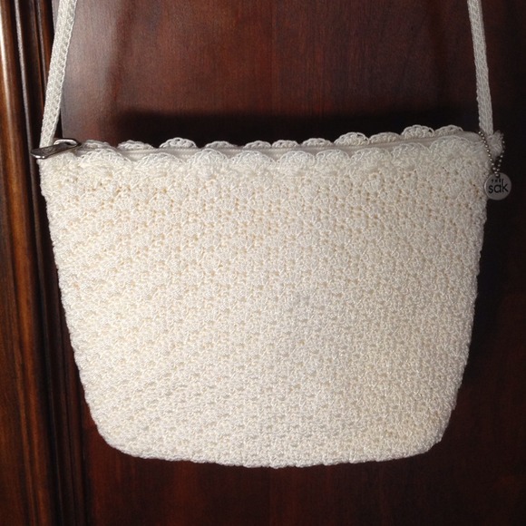 The Sak . Cream embroidered purse.