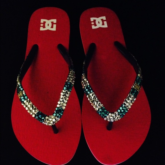 Bright pink, DC brand flip flops covered in bling