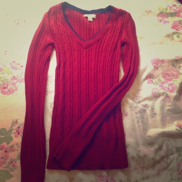 Red long sleeve sweater with blue detail