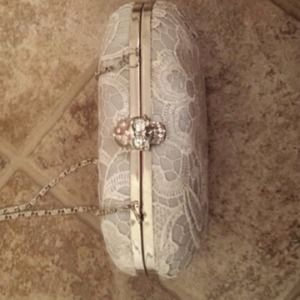 Lace skull accent clutch