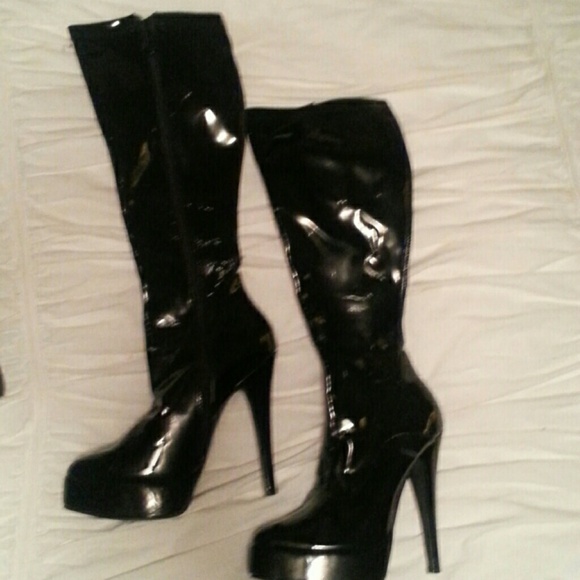 Tall black patent leather boots