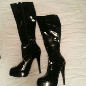 Tall black patent leather boots