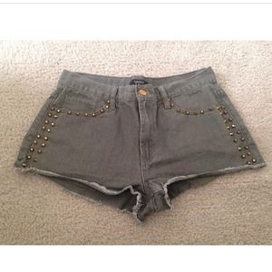 olive green shorts with gold studs 😬