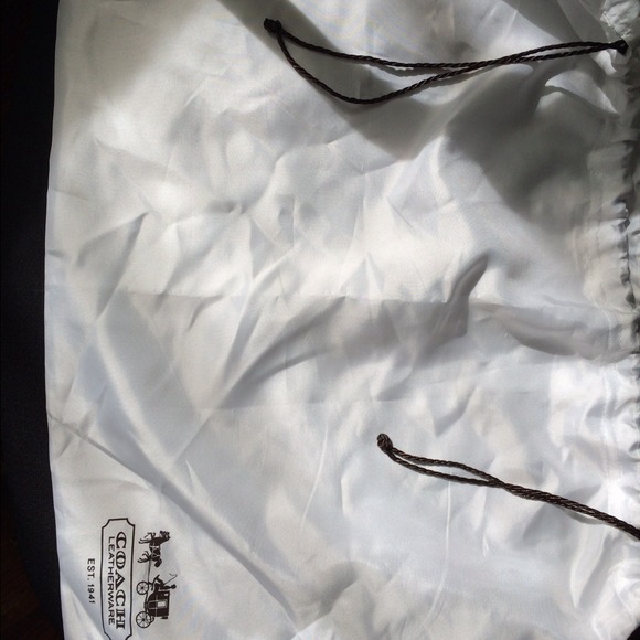 Authentic Coach dust bag in white .