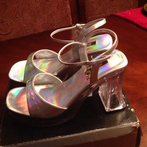Silver charm platform heels. Clear bottom