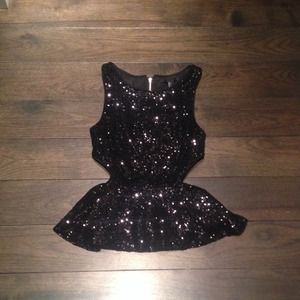 Black sequin cut-out peplum top!