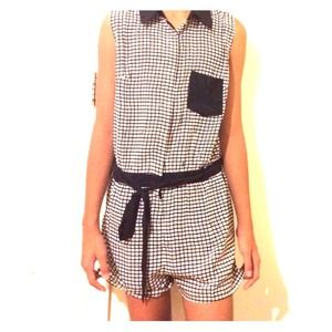 Black and white checkered romper with ribbon.