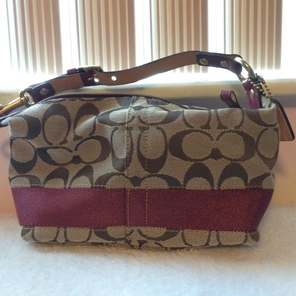 Small Coach burgundy and tan bag.