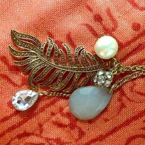 Long brass feather necklace