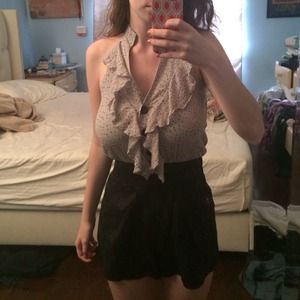 Romper with ruffled top and black shorts