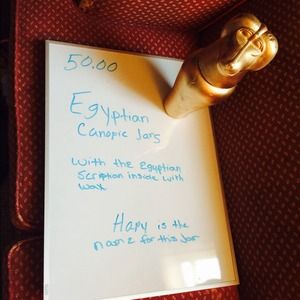 Egyptian canapic jars with scripts and wax inside