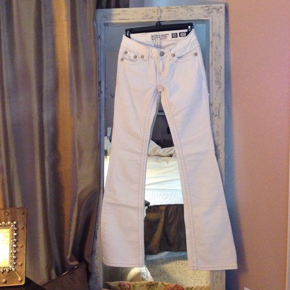 White boot cut Miss Me Jeans.