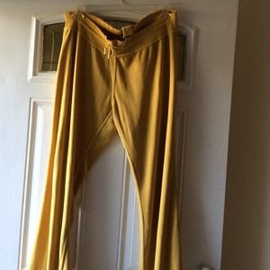 A pair of yellow gold pants size 2X